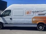 a van that is parked in front of a building