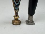 two vases sitting next to each other on a table