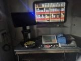 a desk with a computer and a monitor on top of it