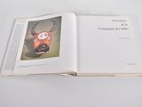 an open book with a picture of a cow on it