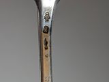 a fork that has some food on it on it
