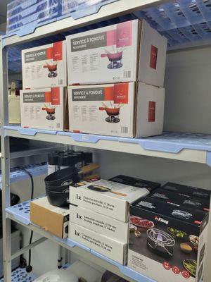 boxes of food are stacked on a shelf in a store