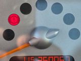 a close up of a speedometer with a clock on it