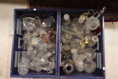 two bins filled with empty plastic bottles on the floor