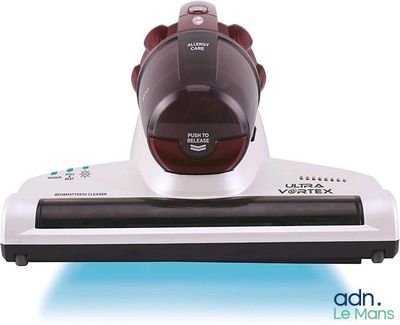 gros plan d'un aspirateur sur une surface blanche