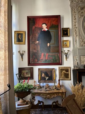 a painting on the wall above a table in a living room