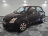 a picture of a small black car on a checkered floor