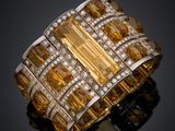 a yellow sapphire and diamond ring