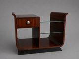 a side table with a glass shelf and a drawer
