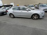 a silver car that is parked in a parking lot