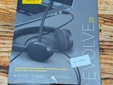 the box of a pair of headphones sitting on top of a wooden table