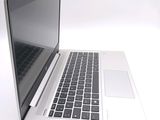 a close up of a laptop computer on a white surface