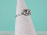 a close up of a ring on a white napkin on a table