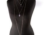 an image of a mannequin with multiple necklaces on it