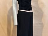 the mannequin is wearing a black top and black pants