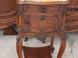 a small table with a marble top on it