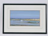 tableau représentant un bateau sur la plage, encadré et accroché au mur