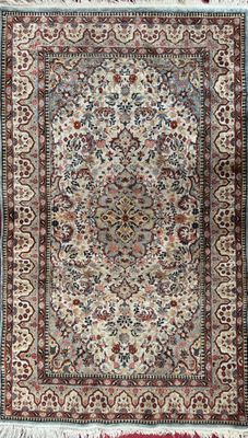 an antique persian rug with a floral design and fringe fringes