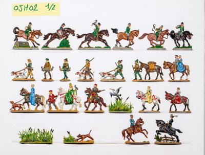 de nombreuses figurines représentant des personnes à cheval et des chiens