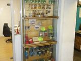 a glass display case in the corner of a room