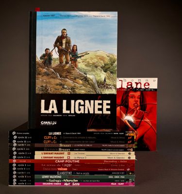 several books are stacked on top of each other on a table