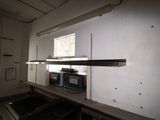 a microwave and a microwave oven in a room