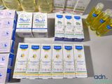 many boxes of soaps and bottles of lotion on a table