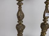 pair of antique brass candlesticks with ornate design