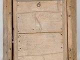 an old wooden box with a metal latch on it