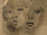 a picture of a painting of two faces on a wall