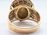 an image of a close up of a ring with a stone in it