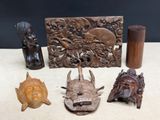 a lot of carved items that are on a table