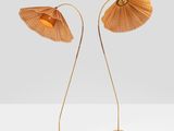 a pair of bamboo lamps on a white surface
