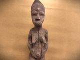 a statue of a man holding a baby in his hands