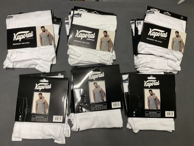 six pairs of white men ' s underwear are on a table