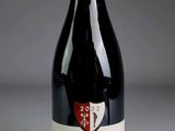 a bottle of wine that is sitting on a table