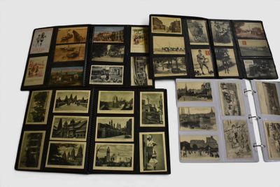 a lot of old photographs on a table