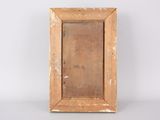an old wooden picture frame with a mirror on a white surface