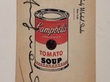 a close up of a piece of paper with a can of soup on it