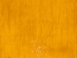 an image of a painting of a yellow square on a wooden surface