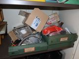 a shelf with many boxes and other items on it