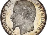Gros plan sur une pièce de monnaie portant le visage d'un homme