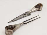 a pair of scissors sitting next to each other on a table
