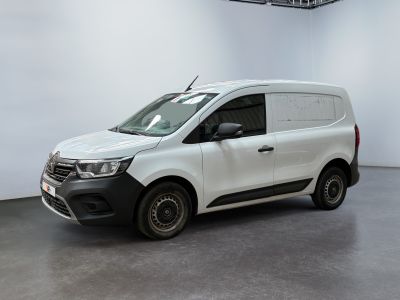 the white van is parked in a large room with a white wall