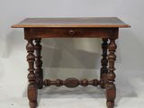 an old wooden table with a drawer underneath it on a white surface