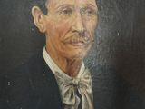 painting of a man in a suit and bow tie in a wooden frame