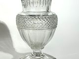 a glass vase that is sitting on top of a table