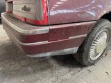 an image of a maroon car parked on the side of the road
