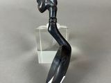 an image of a statue of a woman with a knife in her hand