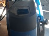 an image of a vacuum cleaner that is on the floor